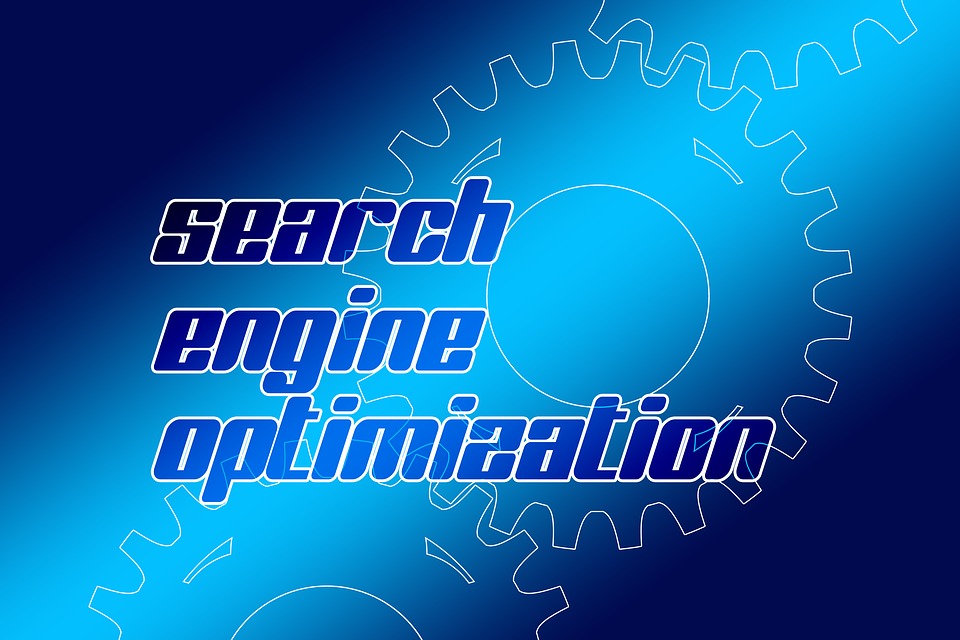 An illustration of blue gears that reads “search engine optimization”.